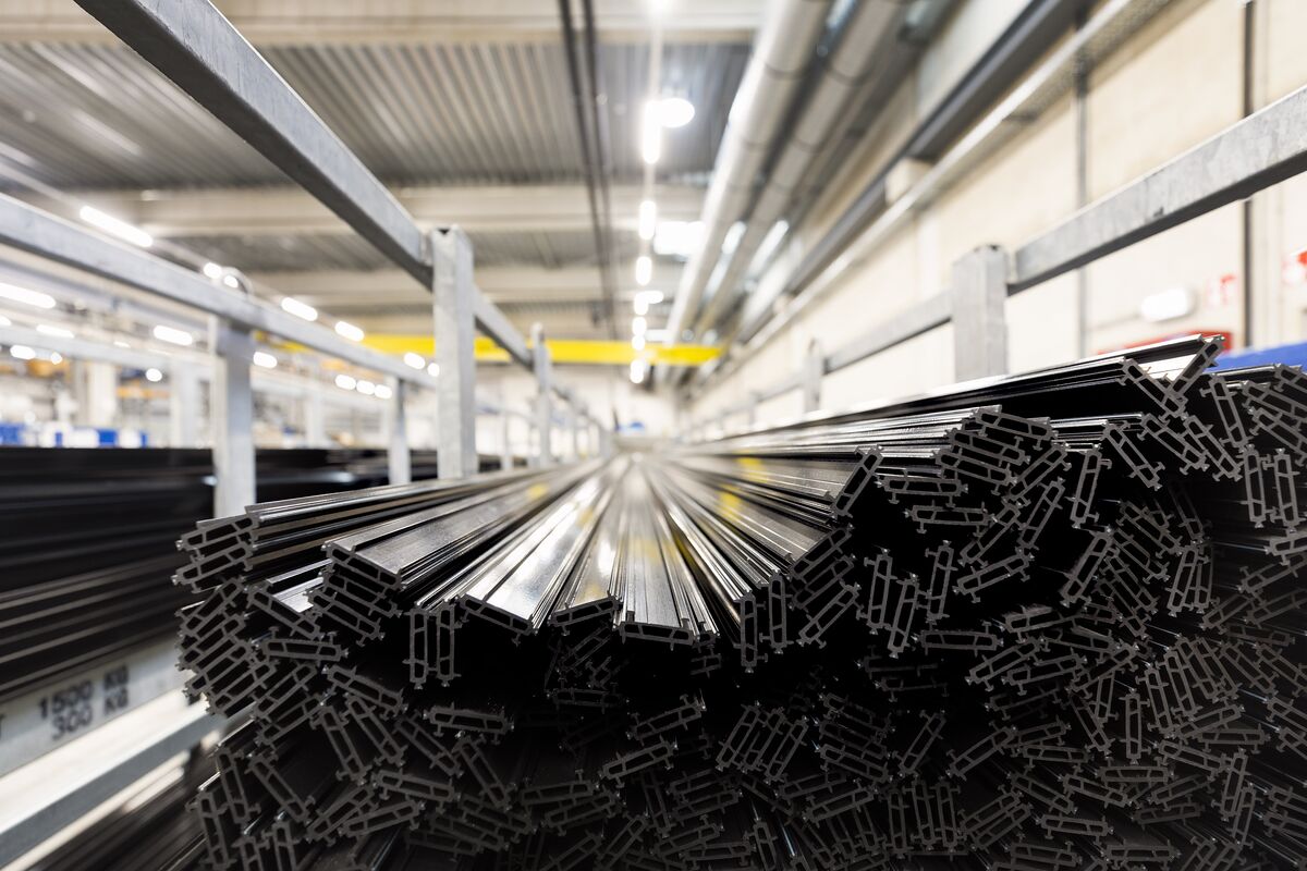 Black thermal strips stacked in iron chassis in warehouse.