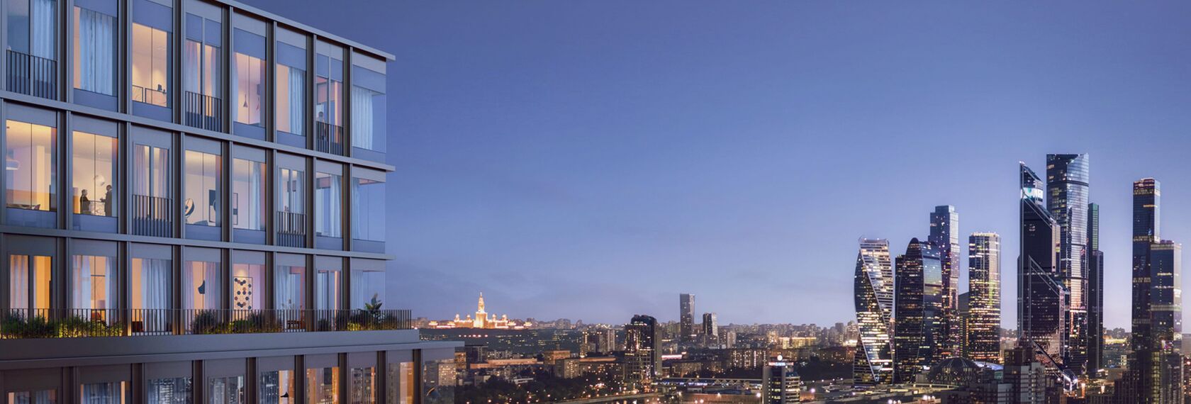 Night view of residential building, looking out over modern city skyline.