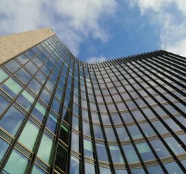 Office building with bronze colour, containing element façades.